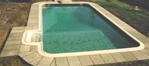 Tan colored Bluestone Pavers surrounding swimming pool